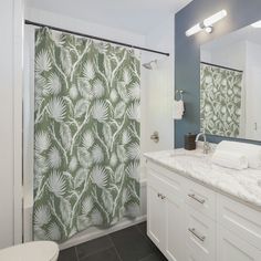 a bathroom with blue and white shower curtain