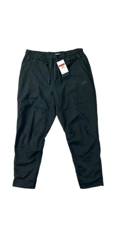 Nike Mens Sportswear Repel Tech Essentials Joggers Pants Black CU4487-010 Size Large New with tags Size large Elevate your activewear game with these Nike Mens Sportswear Repel Tech Essentials Joggers Pants in black. These pants are perfect for any occasion, whether you're hitting the gym, going for a hike, or just running errands. The drawstring closure and elastic waist make them comfortable and secure to wear, while the tapered leg style and standard inseam provide a flattering fit. Made from 100% polyester with a 100% cotton upper lining, these pants are machine washable and easy to care for. They feature pockets for convenient storage and the Nike Tech product line ensures high-quality performance. These joggers are a must-have for any athleisure wardrobe. Nike Outdoor Sportswear Joggers, Black Sportswear Bottoms In Technical Fabric, Black Nike Tech Joggers, Nike Black Moisture-wicking Joggers, Nike Black Moisture-wicking Sweatpants, Nike Tech, Mens Sportswear, Jogger Pants, Running Errands