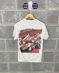 B Blaze Vintage offers this Y2K 2010s Danny Dietrich Sprint Car Dirt Track Racing  Graphic T-Shirt Gildan Tag, Size S Measurements upon request. All flaws will be pictured, see photos for condition.  Please reach out for any questions! Follow us on Instagram!  @BBlazeVintage Refund Policy No refunds will be granted due to dissatisfaction of how the items looks or fits. If there was a flaw in the item you feel that was missed, please reach out to us ASAP to find a solution. If you want measurements on any items and or more photos, just let us know! Racing Shirts Dirt Track, White Racing T-shirt For Sports Events, White Racing Style T-shirt With Graphic Print, Racing Style Graphic T-shirt For Sports Events, Racing Style Graphic Print T-shirt For Sports Events, White Cotton Racing T-shirt, Racing Style Graphic Print T-shirt For Fans, Racing Style Sublimation Print Top For Streetwear, White Racing Style T-shirt For Sports Events