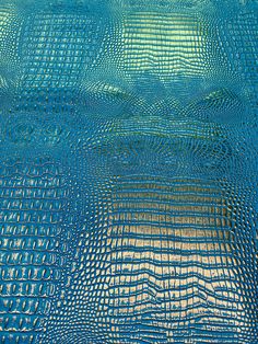 an abstract blue background with squares and lines in the bottom right corner, as if it were woven into fabric