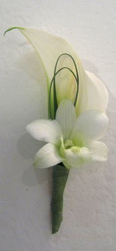 a single white flower is placed on the wall