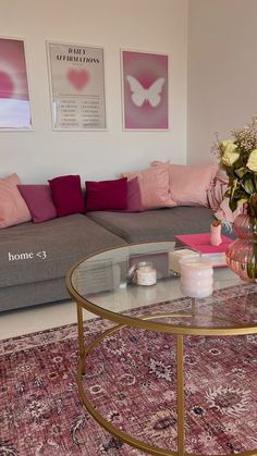 a living room filled with furniture and flowers on top of a coffee table in front of a couch