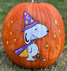 a painted pumpkin with a dog on it