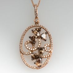 This gorgeous Carlo Viani necklace is crafted of 14k rose gold and features a floral diamond motif. The pendant is set with 6 fancy brown pear cut diamonds, 2 fancy brown round brilliant diamonds, and 94 smaller round brilliant accent diamonds. The total diamond weight is 1.89 carats. The pendant is in excellent condition and hangs from a 14k rose gold 18-inch chain. Ask us about a matching Carlo Viani ring. Luxury Brown Jewelry With Brilliant Cut, Luxury Brown Jewelry With Diamond Accents, Elegant Brown Oval Jewelry, Elegant Oval Brown Jewelry, Elegant Brown Necklace For Anniversary, Elegant Brown Pendant Jewelry, Elegant Brown Oval Pendant Necklace, Floral Pendant Necklace, Pear Cut Diamond