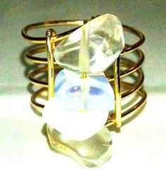 This very special and unique ring is an eye catcher. The setting consists of four opalite stones closed with gold toned copper. Comfortable fit. Goes with any attire. The ring fits U.S. size 5.5 to 6. The is a ring fit for any attire. It can be used as a stackable statement ring. Gold Wire Ring, Opal Statement Ring, Jewelry Opal, Ring Opal, Wire Ring, Wire Rings, Unique Ring, Ring Fit, Gold Wire