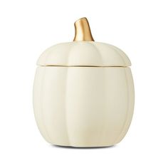 a white ceramic pumpkin container with gold trimmings on the top and bottom, against a white background