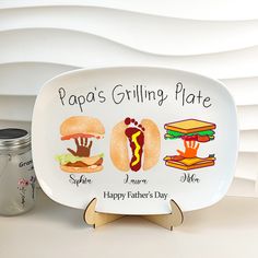 a plate with some food on it and a jar next to it that says papa's grilling plate