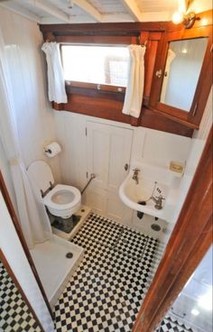 a bathroom with black and white checkered flooring