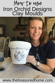 a woman sitting at a table holding up a cup with the words how to use iron orchid designs clay moulds