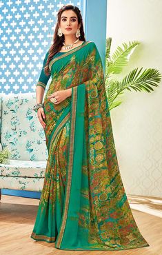 This saree is Ready to Wear (With Fall and Pico Done). Traditional Printed Saree, made up of creative work and graceful fabrics Georgette Comes with 80 cm blouse piece in the saree border Length: 6.30 Meter With Blouse Made up of Pure Fabric Must have saree for your festive collection This saree is a suitable amalgamation of style and grace that is required from ethnic wear. The saree is ideal for any formal gathering. The saree comes with an unstitched blouse of corresponding color and design a Semi-stitched Bollywood Saree With Printed Border, Traditional Kalamkari Print Georgette Pre-draped Saree, Traditional Kalamkari Pre-draped Georgette Saree, Green Pre-draped Saree With Printed Border For Navratri, Traditional Kalamkari Print Georgette Blouse Piece, Traditional Kalamkari Print Georgette Saree, Georgette Saree With Kalamkari Print, Festive Kalamkari Print Georgette Blouse Piece, Festive Georgette Saree With Kalamkari Print