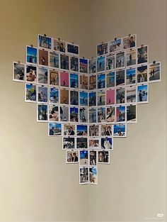 a heart made out of photos hanging on the wall