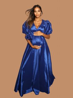 Helena is truly royalty, with her full skirt, puff sleeves, and oversized bow, She will have you feeling like a princess on your special day. The Helena is a beautiful choice for a special event and maternity Photos. Available in 2 vibrant colors. Color Options: Royal Blue, Teal Satin Maternity Dress, Wrap Gowns, Maternity Gown, Spring Baby Shower, Plus Size Gowns, Bridal Wrap, Maternity Gowns, Loungewear Jumpsuit, Maternity Photos