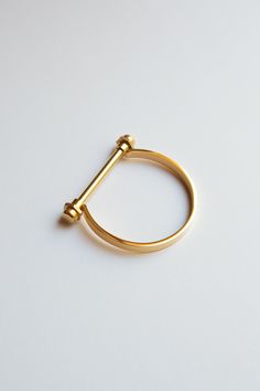 "Minimalist Gold Screw Bar Cuff Bracelet, Gold Bar Bracelet, Gold Screw Cuff Bracelet ✦  Gold Plating over Stainless Steel  ✦  Measure around your wrist and add 1 cm for snug fit and 2 cm for looser fit ✦  Small (Inner Diameter): 2.25\" x 2\", 6.75\" inner circumference (wrist) ✦  Medium (Inner Diameter): 2.5\" x 2.12\", 7.48\" inner circumference (wrist) ✦  High Polish Finish and Sturdy Design ✦  Silver Version: https://www.etsy.com/listing/600918864/minimalist-silver-screw-bar-cuff ✦  Rose Gold Version: https://www.etsy.com/listing/614756975/minimalist-rose-gold-screw-bar-cuff Gold Shackle Bracelet, Gold Horseshoe Bracelet, U shaped Bracelet, U-Shaped, D Bar Bracelet, Gold Stacking Bracelet, Equestrian Bracelet, Gold Bangle, Gold Bracelet, Cuff Bracelet, Minimalist Bangle, Minimalist Bra Equestrian Bracelet, Horseshoe Bracelet, Minimalist Bangle, Cuff Bracelet Gold, Gold Bar Bracelet, Bar Bracelet, Gold Bracelet Cuff, Minimalist Bracelet, Bar Bracelets