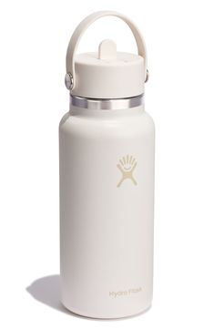 the hydro flask bottle is white and has a handle on it's side