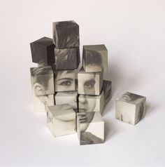 a group of cubes sitting next to each other on top of a white surface