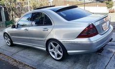 a mercedes benz s - class parked on the street