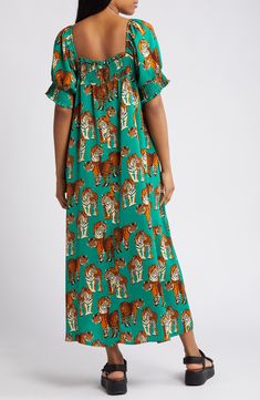 A vibrant and ferocious print emboldens this puff-sleeve maxi designed with shaping smocking at the neckline and cuffs. Slips on over head Square neck Elbow-length sleeves 100% polyester Hand wash, line dry Imported Green Maxi Dress With Gathered Sleeves, Green Smocked Dress With Gathered Sleeves, Vacation Maxi Dress With Gathered Sleeves, Multicolor Maxi Dress With Gathered Sleeves, Daywear Maxi Dress With Smocked Cuffs, Maxi Dress With Smocked Cuffs For Daywear, Maxi Length Dress With Smocked Cuffs For Daywear, Maxi Length Smocked Dress For Daywear, Maxi Dress With Elastic Neckline For Daywear