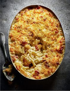 macaroni and cheese in a pan with a spoon