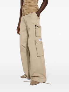 Find DOLCE & GABBANA Wide-leg Cargo Pants on Editorialist. beige cotton gabardine weave appliqué logo belt loops concealed fly and button fastening multiple cargo pockets wide leg drawstring cuffs Beige Cotton Utility Work Pants, Beige Utility Parachute Pants With Belt Loops, Beige Straight Leg Parachute Pants With Belt Loops, Beige Cotton Parachute Pants With Belt Loops, Beige Wide Leg Cargo Pants With Belt Loops, Beige Pants With Belt Loops For Streetwear, Beige Streetwear Pants With Belt Loops, Beige Bottoms With Belt Loops For Streetwear, Beige Patch Pockets Pants For Streetwear