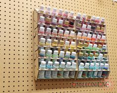 there are many different colors of paint on the wall in this display case, and it's easy to put together