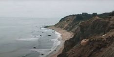 an aerial view of the ocean and cliffs