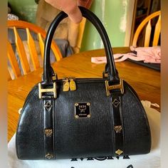 Mcm Mun Chen Dome Handbag Saffiano Black Leather. Pre-Owned In Very Good Condition. Minimal Signs Of Wear. Please See Pictures For Dimensions. Mcm Bags, Black Leather Shoulder Bag, Leather Shoulder Bag, Black Leather, Bag Lady, Shoulder Bag, Handbags, Signs, Leather