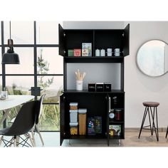 a black shelf with some food on top of it next to a table and chairs