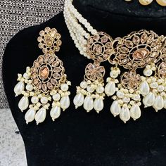 Beautiful brass based Polki Kundan and Moti Jwellery set . Comes with maang tikka , earrings and a choker necklace. The set is finished beautifully at the back with meenakari...the set comes in pastel shades of pink and green and is just splendid. Its intricate designs and stunning details add an elegant touch to your look. Upgrade your jewellery collection with this timeless set. Maang Tikka, Choker Set, Pastel Shades, Gold Polish, Intricate Designs, Jewellery Collection, Handbag Accessories, Pink And Green, Choker