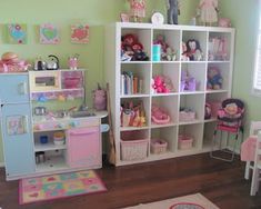 a child's play room with toys and accessories on the shelves in front of it