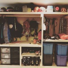 the shelves are filled with various items and storage bins for hats, gloves and other sports equipment