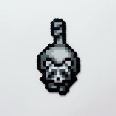 a pixellated image of a skull in the shape of a hand sanitizer