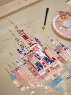 a drawing of a pink castle on top of a table