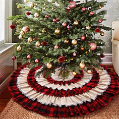 a christmas tree skirt with ornaments on it