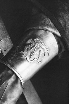 a black and white photo of a leather glove