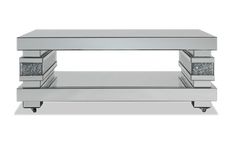 a mirrored coffee table with wheels on each side and two drawers underneath it, in front of a white background