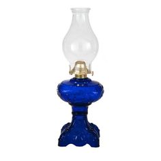 a blue glass lamp with a gold base