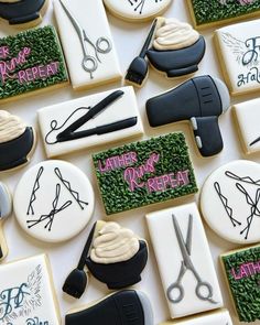 decorated cookies with scissors, hairdryer, and other items on top of them