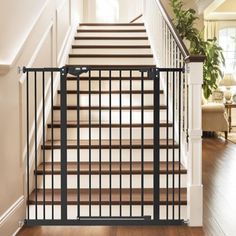 a stair gate that is on the side of a staircase