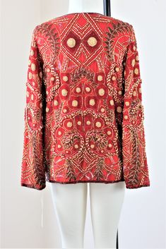 "Stunning ...heavily beaded..with gold and beads throughout...this is soo heavy and oh so beautiful!! Excellent for anytime of year. Are you a red person? This is a great jacket to put against a black dress..or simple outfit..to dress it up and make it formal!! Excellent condition! Measuring: 25\" length Width: 40\" Sleeves: 23\" Pet Free/smoke free Enjoy!" Glamorous Embellished Outerwear For Festive Occasions, Fall Festive Outerwear With Gold Embroidery, Festive Fall Outerwear With Gold Embroidery, Festive Party Outerwear With Gold Embroidery, Embellished Red Outerwear For Fall, Winter Party Outerwear With Gold Embroidery, Holiday Embellished Long Sleeve Outerwear, Red Embellished Outerwear For Fall, Festive Bohemian Embellished Outerwear