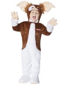 a young boy dressed in a brown and white costume with horns on it's head