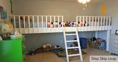 there is a bunk bed with a ladder in the room and toys on the floor