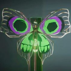 a green and purple butterfly with large eyes on it's wings is shown from the front view