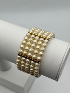 A gorgeous vintage Monet faux pearl cuff bracelet. Excellent vintage condition - most likely unworn, as the elastic part of the original price tag is still attached.  Signed Monet. The dimensions are approx 18.5cm x 3cm. -------------------- 🌟 P&P: 👉 Will arrive gift wrapped, in a padded bag. 👉 UK shipping: Royal Mail Tracked 24 👉 International Shipping: Royal Mail International Tracked -------------------- 💎 FOLLOW US:  👉 www.instagram.com/janedreamsofvintage 👉 www.facebook.com/JaneDream Padded Bag, Pearl Cuff Bracelet, Pearl Cuff, Pad Bag, Vintage Monet, Price Tag, Royal Mail, Cuff Bracelet, Faux Pearl