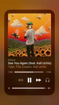 the music player is playing an album on his cell phone, with sunflowers in the background