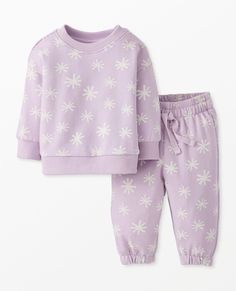 Sweats set for baby in fun holiday prints fit for any festive occasion! Made in supersoft and durable French terry knit. • Matching set for easy outfitting • Easy pull on sweatshirt and sweatpants with adjustable drawcord • Like new wash after wash • OEKO-TEX® STANDARD 100 certified safe from hundreds of harsh chemicals Lightweight 100% combed cotton French terry knit Easy fit Neck banding Soft stretch ribbed neck, cuffs, and hem Dropped shoulder Encased elastic waistband with adjustable drawcord Back patch pocket Encased elastic leg openings OEKO-TEX® STANDARD 100 | Prewashed Imported. Baby, Baby Girl Clothes, Sets. | Baby Holiday French Terry Sweats Set - Size 3-6 mos - Snowflakes On Orchid Hush - Hanna Andersson