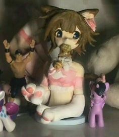 a group of toy figurines sitting next to each other