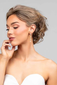 Make a chic statement with our PEARLA earrings! Featuring a pave crystal huggie push back post, a long thin pearl and crystal drop, all set in sterling silver and plated in either rhodium or gold. Elevate any outfit with these elegant and versatile earrings. You'll be the envy of every fashionista! Earring Jewelry Box, Yellow Jewelry, Pearl Shop, Bridal Clutch, Monogram Jewelry, Pearl Collection, Bridal Belt, Hair Accessories Jewelry, Crystal Drop