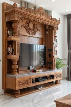 a large wooden entertainment center in the middle of a living room with white marble floors