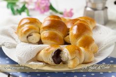 several croissants are on a plate with a napkin