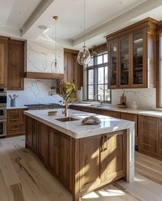 a large kitchen with wooden cabinets and marble counter tops, along with hardwood flooring